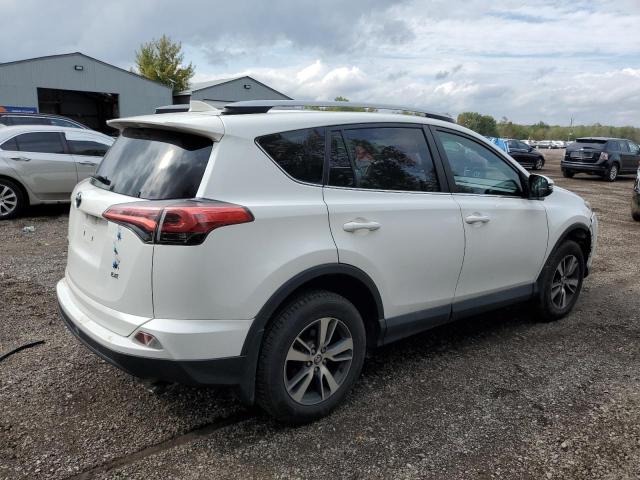 Photo 3 from auction – 2018 TOYOTA RAV4 LE with VIN 2T3ZFREV2JW422752