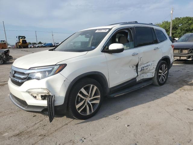 HONDA PILOT TOUR 2016 with VIN 5FNYF6H98GB071689 - Photo from auction