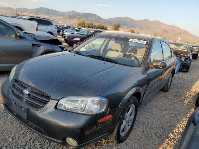 NISSAN MAXIMA GLE 2000 with VIN JN1CA31D0YT559087 - Photo from auction