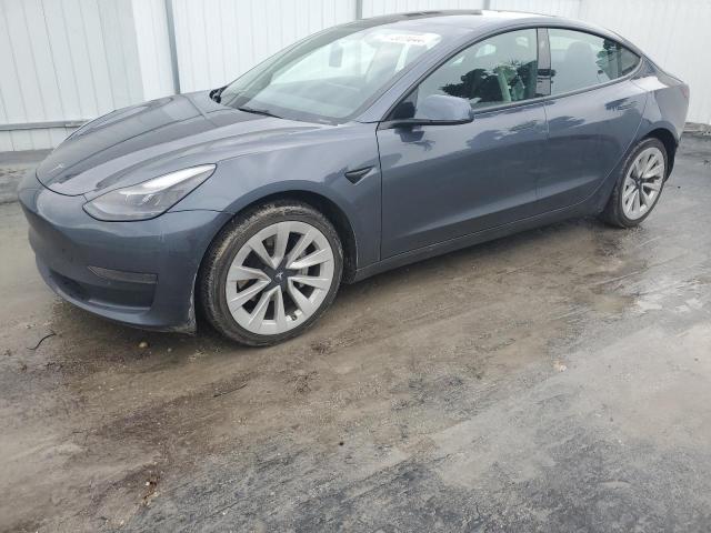 TESLA MODEL 3 2022 with VIN 5YJ3E1EAXNF372458 - Photo from auction