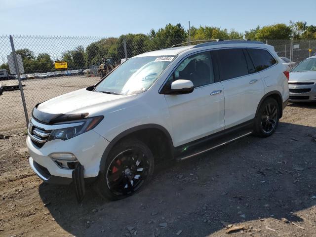 HONDA PILOT ELIT 2017 with VIN 5FNYF6H00HB001557 - Photo from auction