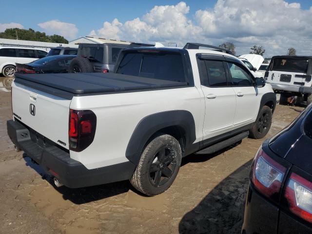 Photo 3 from auction – 2023 HONDA RIDGELINE with VIN 5FPYK3F83PB056416