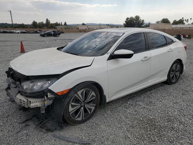 HONDA CIVIC EX 2018 with VIN JHMFC1F31JX009256 - Photo from auction