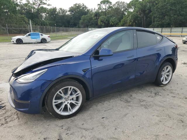 TESLA MODEL Y 2023 with VIN 7SAYGDEE0PA153144 - Photo from auction