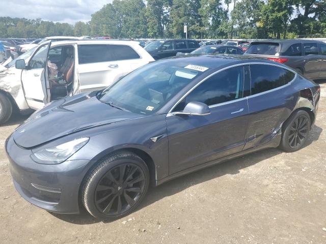 TESLA MODEL 3 2018 with VIN 5YJ3E1EA0JF032052 - Photo from auction