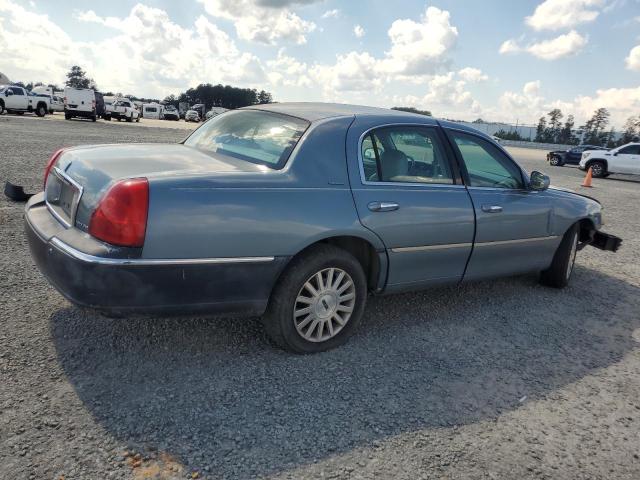 Photo 3 from auction – 2004 LINCOLN TOWN CAR E with VIN 1LNHM81W64Y657011