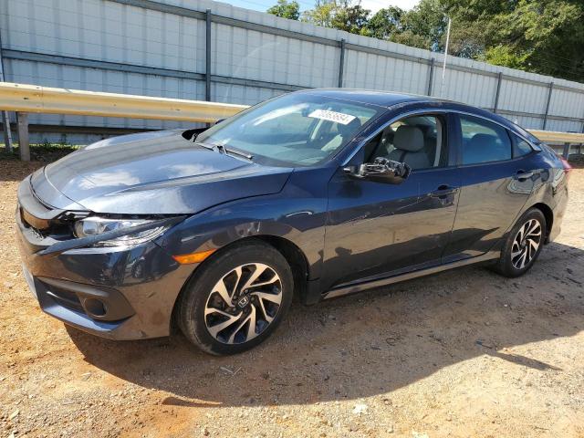 HONDA CIVIC LX 2018 with VIN 19XFC2F57JE024787 - Photo from auction