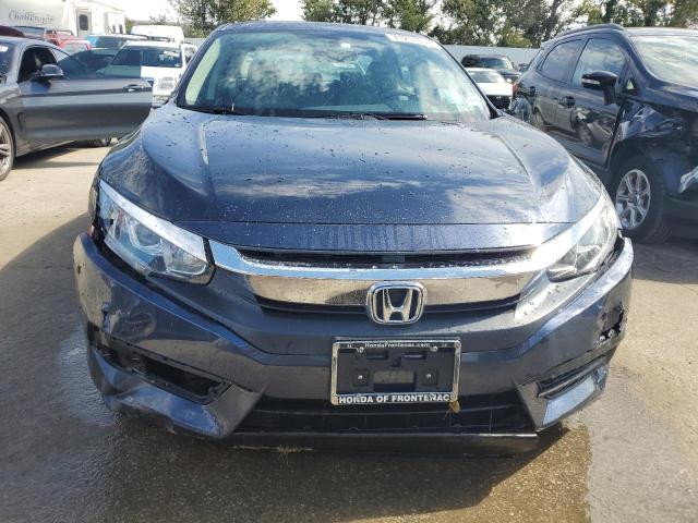 Photo 5 from auction – 2018 HONDA CIVIC EX with VIN 19XFC2F75JE001252
