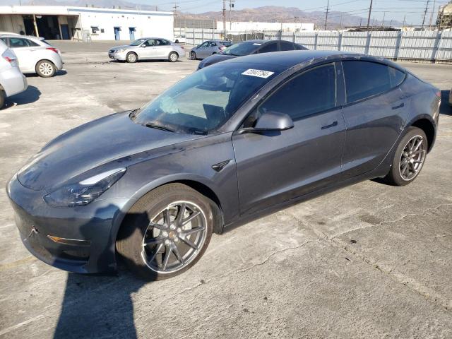 TESLA MODEL 3 2023 with VIN 5YJ3E1EA8PF411034 - Photo from auction