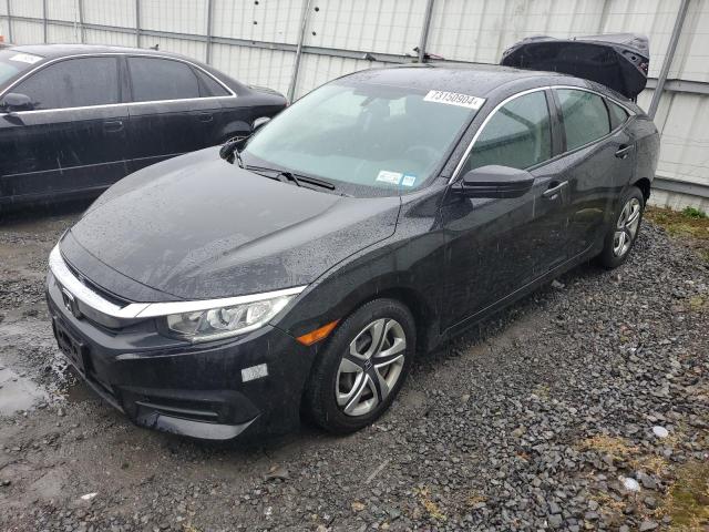 HONDA CIVIC LX 2018 with VIN 2HGFC2F52JH549312 - Photo from auction