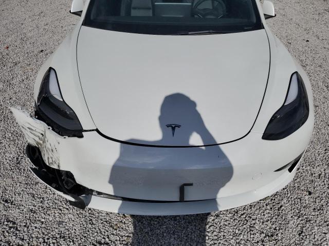 Photo 11 from auction – 2022 TESLA MODEL 3 with VIN 5YJ3E1EB9NF328413