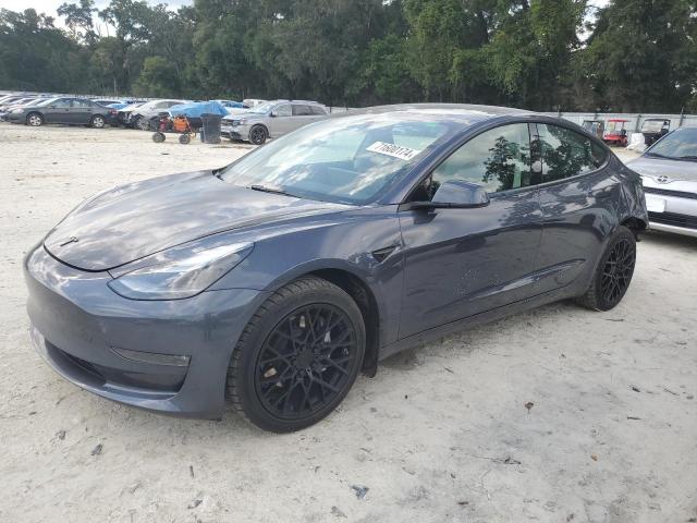TESLA MODEL 3 2022 with VIN 5YJ3E1EB9NF285594 - Photo from auction