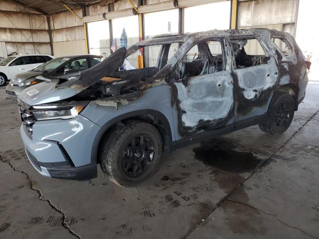 HONDA PILOT TRAI 2023 with VIN 5FNYG1H68PB048581 - Photo from auction