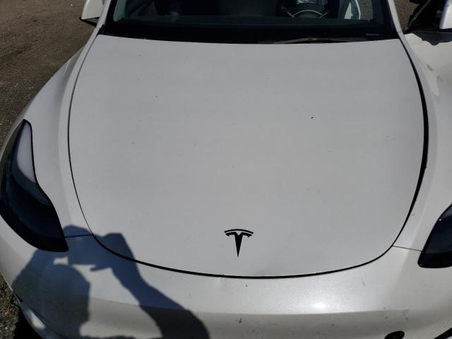 Photo 12 from auction – 2023 TESLA MODEL Y with VIN 7SAYGDEE0PF695668