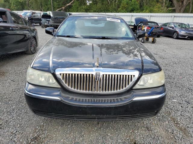 Photo 5 from auction – 2004 LINCOLN TOWN CAR E with VIN 1LNHM81W14Y660723