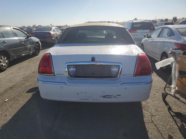 Photo 6 from auction – 2004 LINCOLN TOWN CAR E with VIN 1LNHM81W74Y669443
