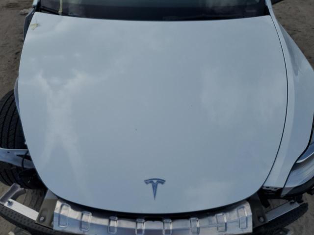 Photo 12 from auction – 2023 TESLA MODEL Y with VIN 7SAYGAEE5PF603999