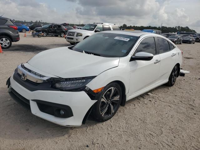 HONDA CIVIC TOUR 2017 with VIN 19XFC1F95HE031633 - Photo from auction