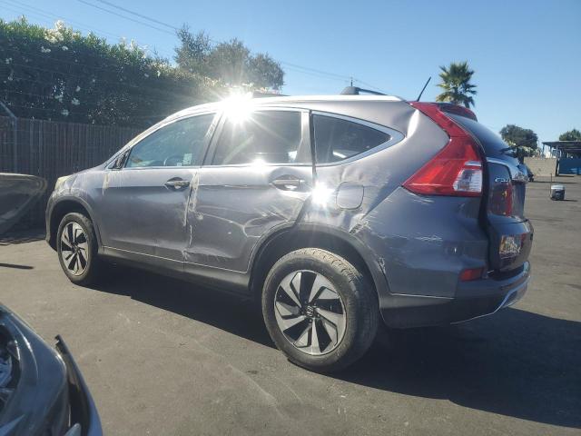 Photo 2 from auction – 2016 HONDA CR-V TOURING with VIN 5J6RM3H98GL001934