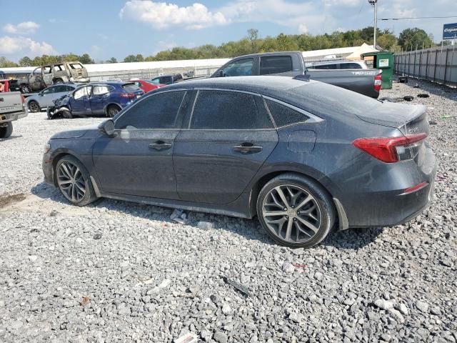 Photo 2 from auction – 2023 HONDA CIVIC TOURING with VIN 2HGFE1F97PH302142