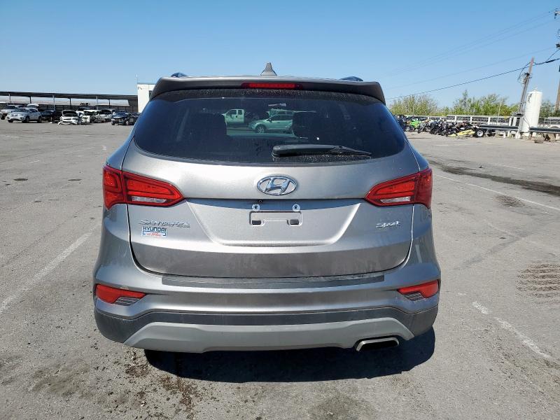 Photo 6 from auction – 2018 HYUNDAI SANTA FE S with VIN 5NMZU3LB2JH101312