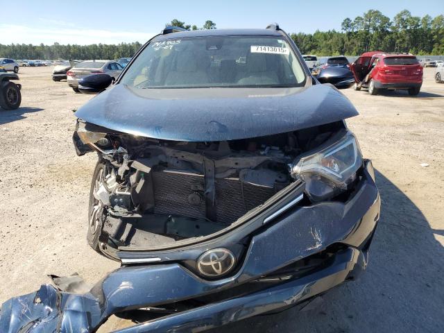 Photo 5 from auction – 2018 TOYOTA RAV4 with VIN JTMWFREV0JJ743903