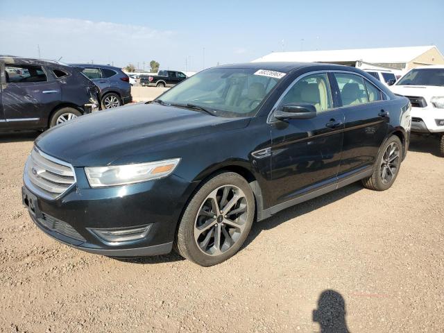 FORD TAURUS SEL 2014 with VIN 1FAHP2H8XEG129453 - Photo from auction