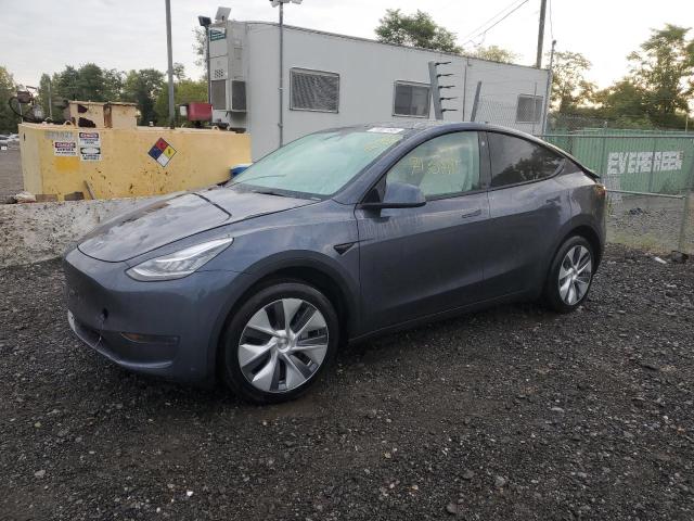 TESLA MODEL Y 2023 with VIN 7SAYGDEE2PA106990 - Photo from auction