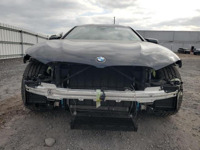 Photo 5 from auction – 2022 BMW M8 with VIN WBSGV0C02NCJ55174