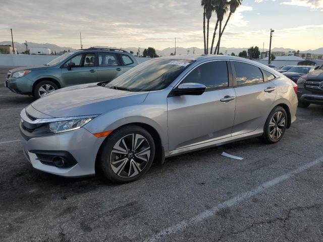 HONDA CIVIC EXL 2018 with VIN JHMFC1F71JX024553 - Photo from auction