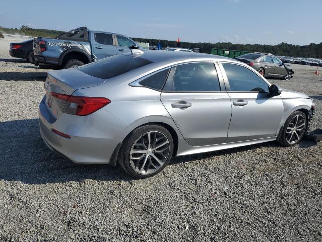 Photo 3 from auction – 2023 HONDA CIVIC TOURING with VIN 2HGFE1F91PH307966
