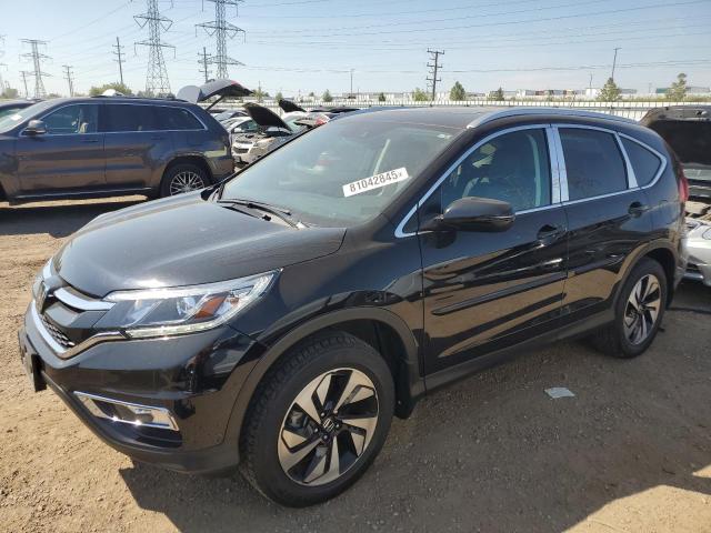 HONDA CR-V TOURING 2016 with VIN 5J6RM4H93GL101798 - Photo from auction