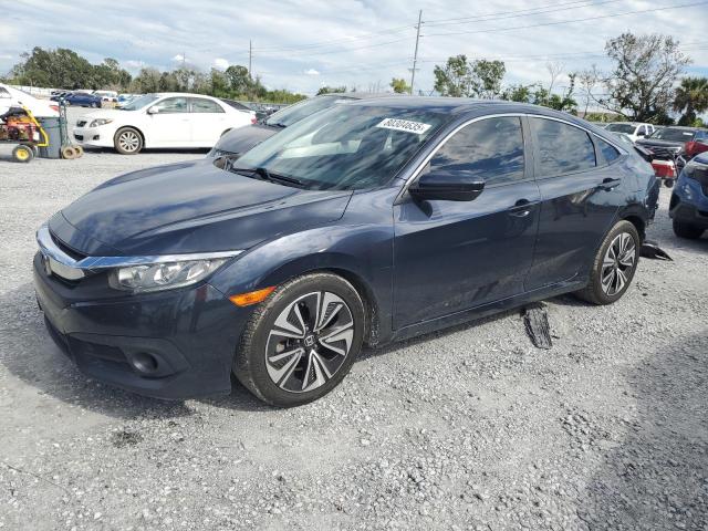 HONDA CIVIC EX 2018 with VIN JHMFC1F34JX016587 - Photo from auction