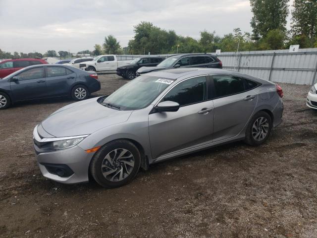 HONDA CIVIC EX 2018 with VIN 2HGFC2F87JH004586 - Photo from auction