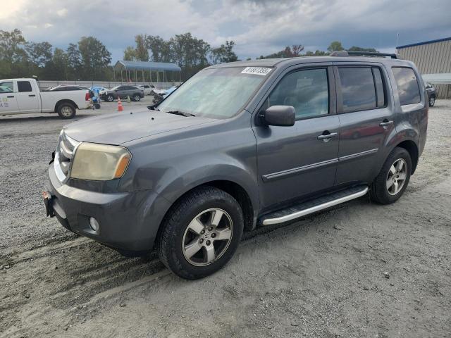 HONDA PILOT EXL 2011 with VIN 5FNYF3H52BB009032 - Photo from auction