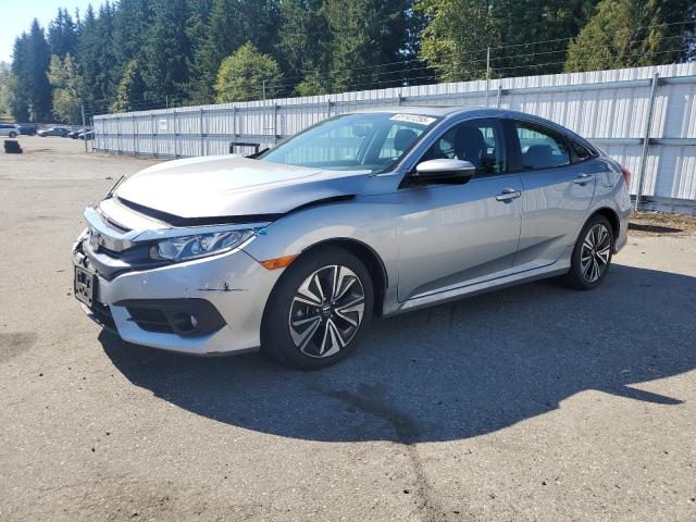 HONDA CIVIC EXL 2017 with VIN 2HGFC1F79HH652040 - Photo from auction