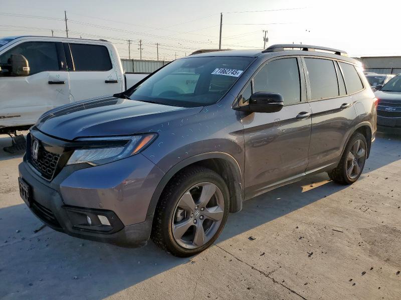Photo 1 from auction – 2021 HONDA PASSPORT with VIN 5FNYF7H97MB011906