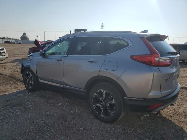 Photo 2 from auction – 2018 HONDA CR-V with VIN 7FARW2H95JE097594