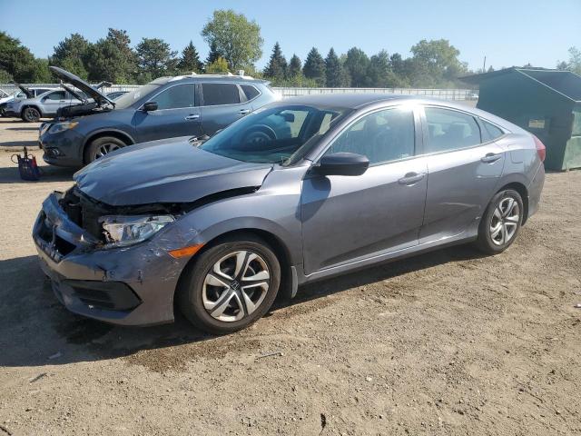 HONDA CIVIC LX 2018 with VIN 2HGFC2F55JH570302 - Photo from auction
