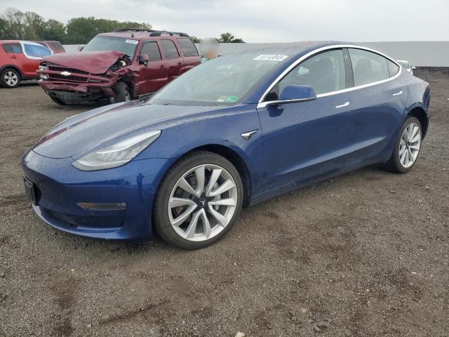 TESLA MODEL 3 2018 with VIN 5YJ3E1EA9JF015587 - Photo from auction