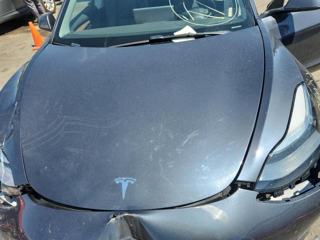 Photo 11 from auction – 2022 TESLA MODEL 3 with VIN 5YJ3E1EB9NF243569