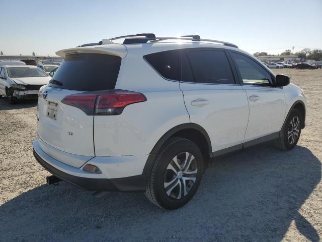 Photo 3 from auction – 2017 TOYOTA RAV4 LE with VIN JTMZFREV8HJ104031