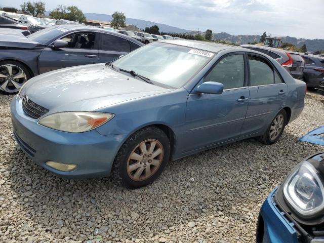 TOYOTA CAMRY LE 2003 with VIN 4T1BF30KX3U553449 - Photo from auction