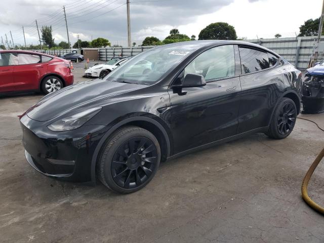 TESLA MODEL Y 2024 with VIN 7SAYGDEEXRA220836 - Photo from auction