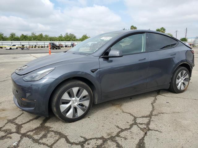 TESLA MODEL Y 2023 with VIN 7SAYGDEE1PF910670 - Photo from auction