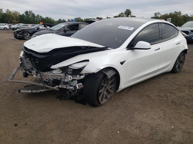 TESLA MODEL 3 2022 with VIN 5YJ3E1EB3NF165029 - Photo from auction