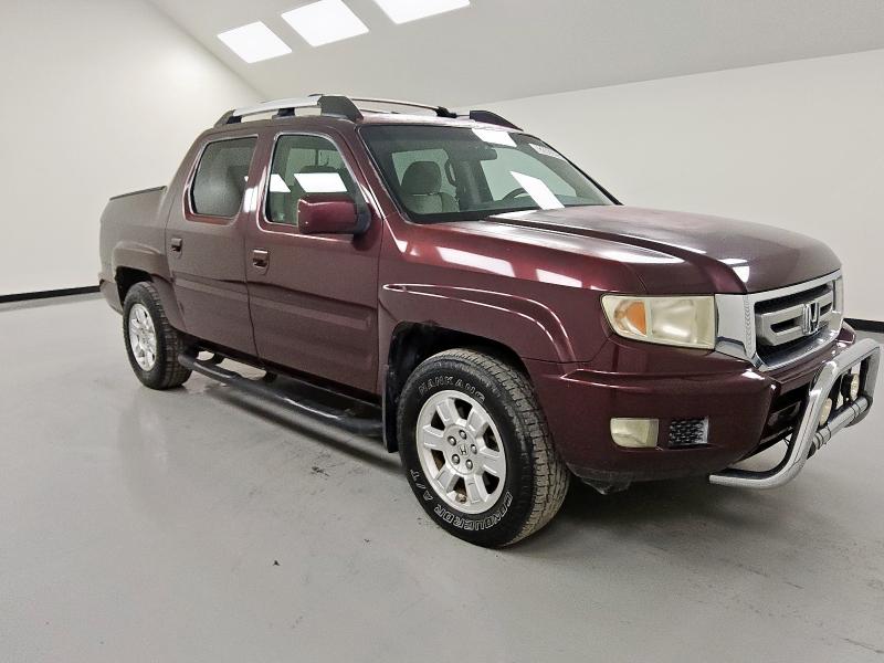 Photo 4 from auction – 2011 HONDA RIDGELINE with VIN 5FPYK1F47BB006354