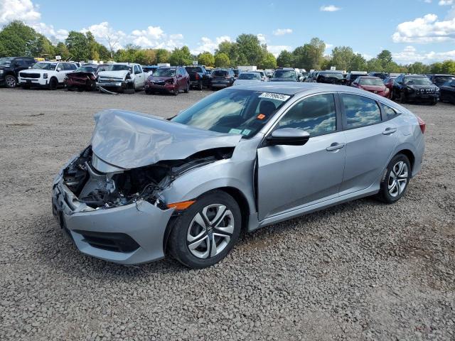 HONDA CIVIC LX 2018 with VIN 19XFC2E5XJE034764 - Photo from auction