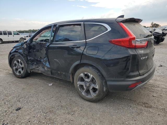 Photo 2 from auction – 2017 HONDA CR-V with VIN 7FARW1H5XHE032502