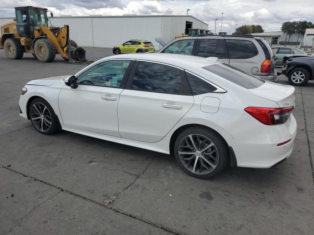 Photo 2 from auction – 2023 HONDA CIVIC TOURING with VIN 2HGFE1F93PH314529